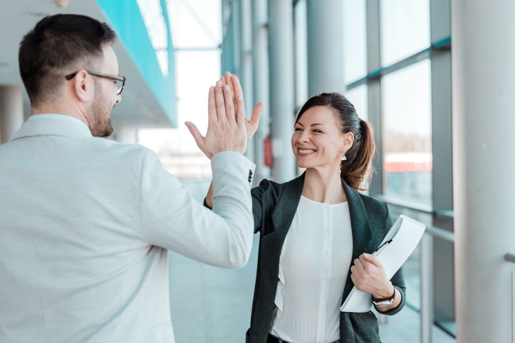 successful high-five after working with a recruiter